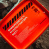 an orange container with black text